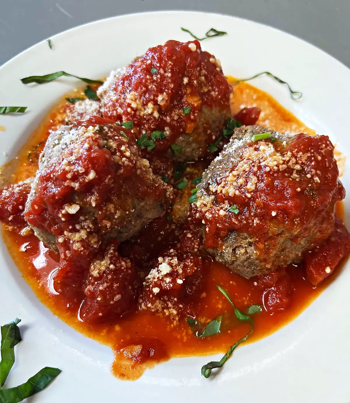 Meatballs in tomato sauce with grated cheese