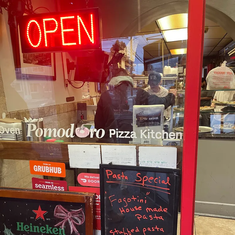 The front window, with the OPEN sign and the chalkboard specials